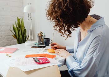 financial calculators - woman with calculator image