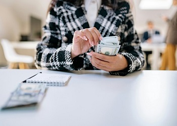 woman counting money image